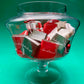 large bowl filled with chocolate pieces with Christmas ornaments