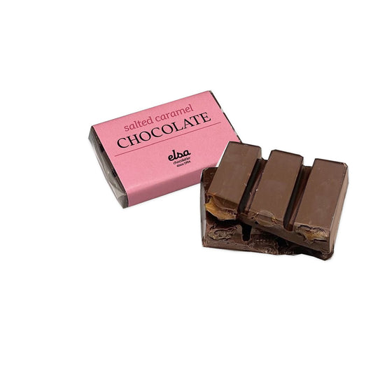 Salted caramel mini chocolate bar with its pink wrapper and two stacked pieces showing the caramel filling