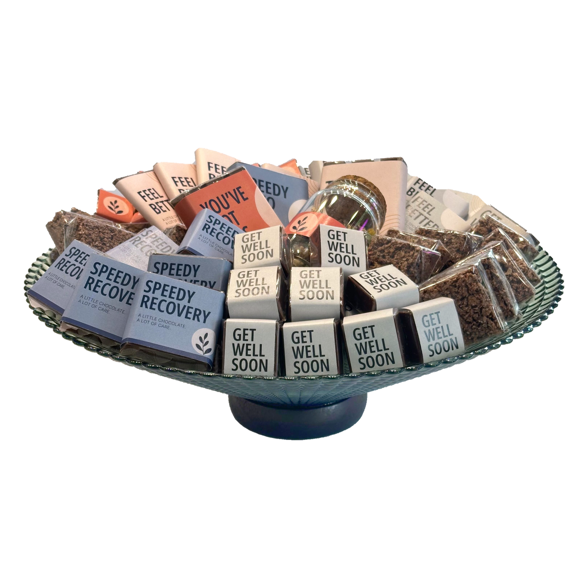Front view of Get Well Soon chocolates arranged on a green glass pedestal plate