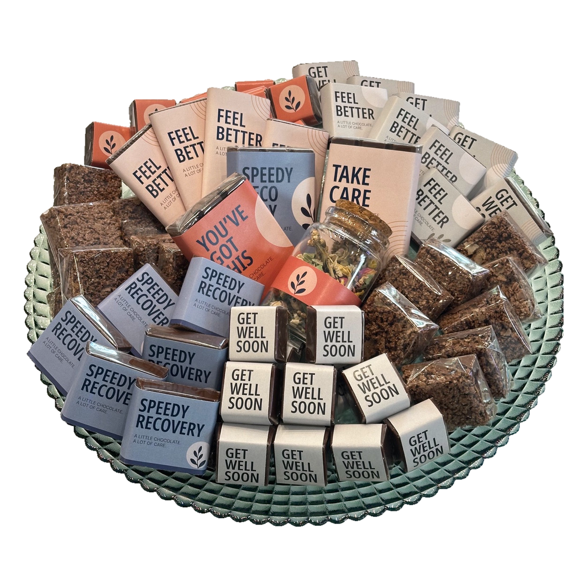 Overhead view of Get Well Soon chocolates arranged on a green glass pedestal plate