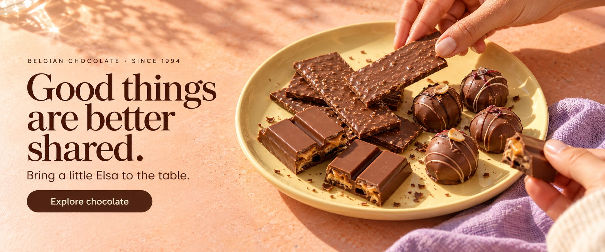 Chocolate thins, filled chocolate bars and chocolate gems shared on a sunlit table.